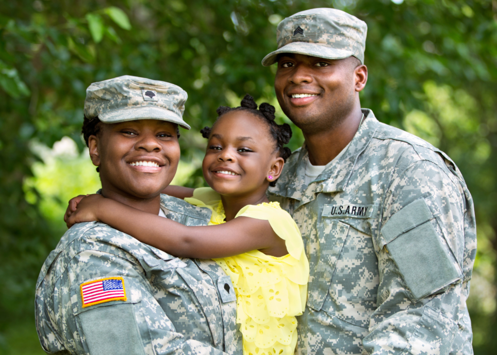 A black military family of three.