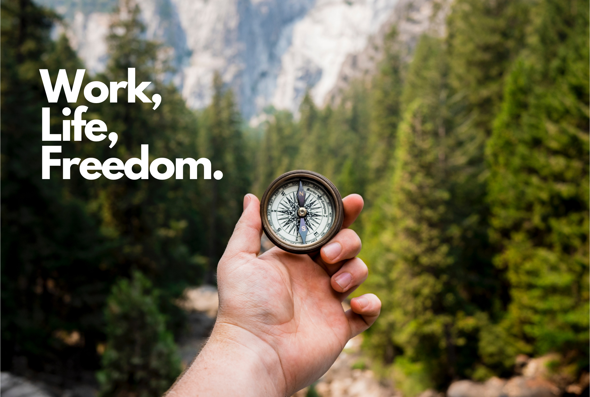 A Hand Holding a Compass in the Woods With the Words "Work, Life, Freedom."